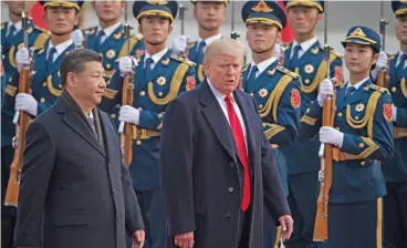  ?? (AFP) ?? This file photo shows China’s President Xi Jinping (left) and US President Donald Trump in Beijing on November 9, 2017