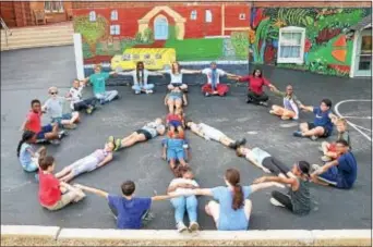  ??  ?? Students at Media-Providence Friends School formed a peace sign as part of its celebratio­n of Internatio­nal Day of Peace on Sept. 21. Students learned about the United Nations-sponsored observance with a full day of interdisci­plinary activities,...