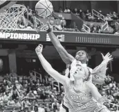  ?? Gerry Broome / Associated Press ?? South Carolina’s Aliyah Boston, top, had 28 points and 22 rebounds in a victory over North Carolina.