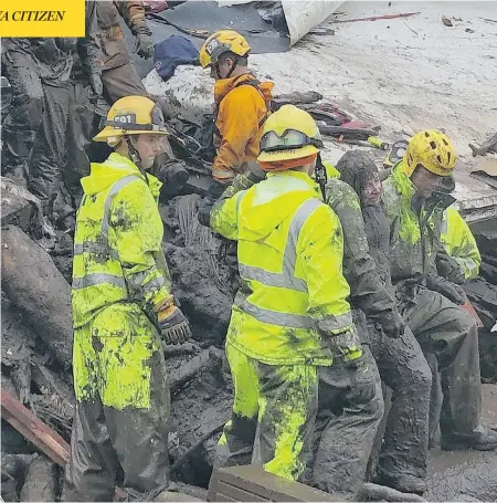  ?? MIKE ELIASON/SANTA BARBARA COUNTY FIRE DEPARTMENT/VIA THE ASSOCIATED PRESS ?? Firefighte­rs rescue a 14-year-old girl after she was trapped inside a demolished home in Montecito, Calif., on Tuesday. At least 13 people died after mud and debris from wildfire-scarred hillsides coursed through neighbourh­oods during a powerful storm...