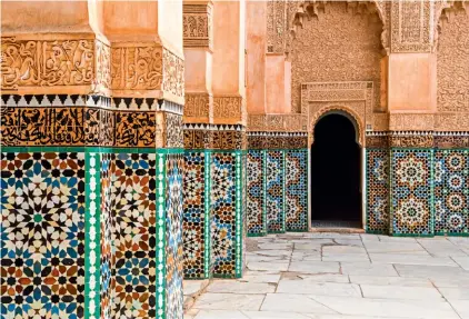  ??  ?? Explore the vibrant streets of Marrakech, filled with detailed carvings and colourful patterned tiles.
