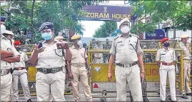  ??  ?? Assam security personnel stand vigil outside Mizoram House in Guwahati on July 29.