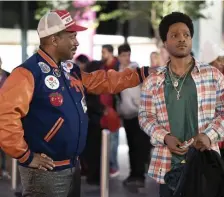  ??  ?? FAMILY REUNION: Prince Akeem (Eddie Murphy, left) returns to New York to connect with Lavelle (Jermaine Fowler), the son he didn’t know he had.