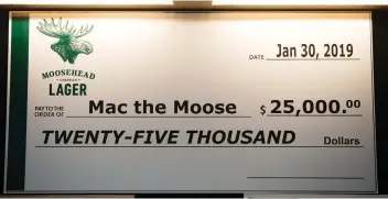  ??  ?? A mock cheque made out to the statue known as Mac the Moose represents $25,000 donated by Moosehead Breweries toward a fundraisin­g drive to make Mac the world’s tallest moose again.