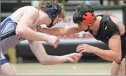  ??  ?? Gordon Lee’s Montgomery Kephart (left) and Lafayette’s Hunter Deal square off in a 170-pound bout during Thursday’s county clash in Lafayette.