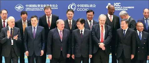  ?? FENG YONGBIN / CHINA DAILY ?? Participan­ts attending the Belt & Road Trade and Investment Forum, held in Beijing on Thursday, prepare for a group photo.