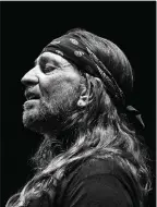  ?? Democrat-Gazette/Art Meripol) ?? This Art Meripol portrait of Willie Nelson captured the crooner wearing a rapt expression. (Special to the