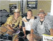  ??  ?? BEHIND THE WIRE: Khoi and San activists, from left, ANC MPL Christian Martin, Trevor Kopeleng and Crawford Fraser, in the makeshift animal cage they will be sleeping in for 11 days