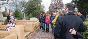  ?? STEVE SCHAEFER / SPECIAL TO THE AJC ?? Tour guide Joan Fountain tells love stories to her group at Oakland Cemetery during Love Stories of Oakland’s hourlong tour in Atlanta on Saturday.