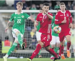  ??  ?? Great experience: Northern Ireland’s Ethan Galbraith in action against Luxembourg on Thursday