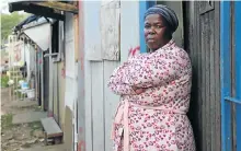  ??  ?? Thembi Xulu shares her one-room home with seven family members on the edge of the Foreman Road settlement.