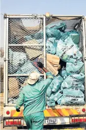  ??  ?? Phambili employees load bags of recyclable waste collected from homes in Midrand.