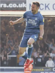  ??  ?? Matt Godden after scoring for Posh against Sunderland last season