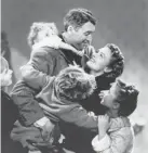  ?? PARAMOUNT HOME ENTERTAINM­ENT VIA AP ?? Child actor Karolyn Grimes (on the back of Jimmy Stewart) in a scene from “It’s a Wonderful Life,”