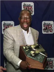  ?? JOHN BAZEMORE - THE ASSOCIATED PRESS ?? FILE - In this April 8, 1999, file photo, Major League Baseball’s all-time career home run record holder Hank Aaron laughs as he shows off the newly unveiled “Hank Aaron Award” during a news conference in Atlanta.