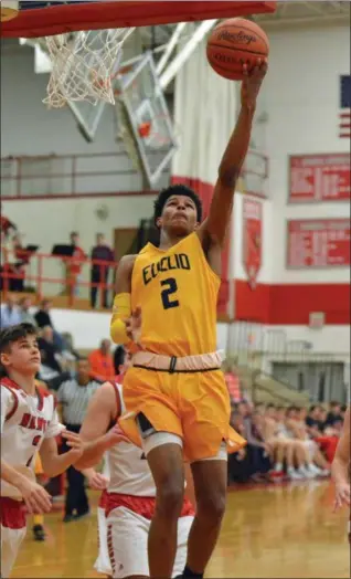  ?? PAUL DICICCO — THE NEWS-HERALD ?? Euclid’s William Saunders glides in for a layup Feb. 13 at Mentor. Saunders had 39 in the Panthers’ 85-72 win.