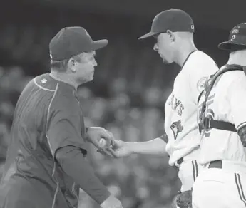  ?? CARLOS OSORIO/TORONTO STAR ?? Jays starter Aaron Sanchez gets the hook from manager John Gibbons in the fifth after allowing six earned runs.