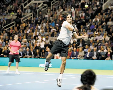  ?? Photos by Scott Strazzante / The Chronicle ?? Roger Federer hits a forehand during the doubles portion of the Match for Africa 5 fundraiser for education in South Africa.