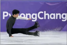  ?? DAVID J. PHILLIP — THE ASSOCIATED PRESS ?? Nathan Chen of the United States falls while performing during the men’s short program figure skating in the Gangneung Ice Arena at the 2018 Winter Olympics in Gangneung, South Korea, Friday.