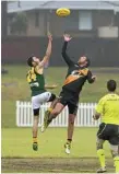  ?? PHOTO: KEVIN FARMER ?? ON TARGET: Trent Ballin (right) will be keen to kick more goals for Toowoomba Tigers after six in the first round.