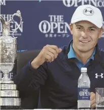  ?? AP PHOTO ?? FEELING GRAND: Jordan Spieth, with the claret jug by his side, talks to the media Sunday after winning the British Open for his third major victory.