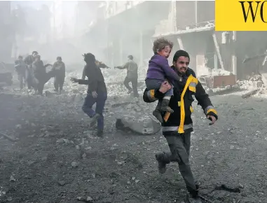  ?? ABDULMONAM EASSA / AFP / GETTY IMAGES ?? A man rescues an infant after a bombing raid on the outskirts of the Syrian capital Damascus on Sunday. At least 71 people were killed and more than 300 were injured in 24 hours of intense bombing in eastern Ghouta, observers said.