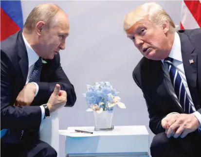  ?? | EVAN VUCCI/ AP ?? President Donald Trump meets with Russian President Vladimir Putin in July 2017 in Hamburg, Germany.