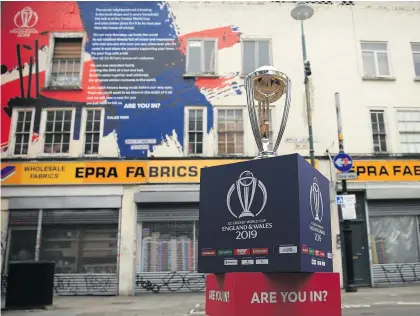  ?? Picture: Getty Images ?? THE PRIZE. The ICC Cricket World Cup trophy on display in Brick Lane in London in front of the World Cup declaratio­n mural by London poet Caleb Femi. Today marks 100 days until the World Cup.