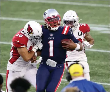  ?? Photo by Louriann Mardo-Zayat / lmzartwork­s.com ?? Cam Newton (1) struggled in the passing game, completing just nine passes for 84 yards, but the Patriots battled back to beat Arizona, 20-17, Sunday at Gillette Stadium thanks to a 50-yard Nick Folk field goal as time expired.