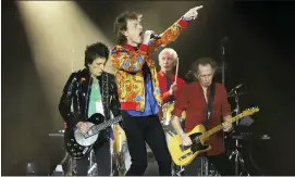  ??  ?? The Rolling Stones — from left, Ronnie Wood, Mick Jagger, Charlie Watts and Keith Richards — perform in East Rutherford, N.J., in 2019.