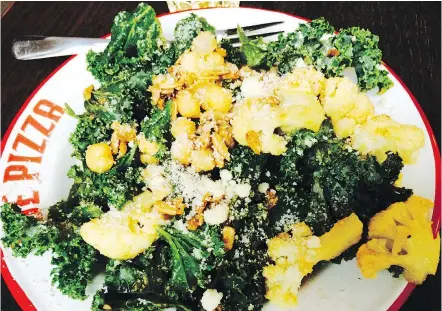  ??  ?? Kale cauliflowe­r salad at Joe Pizza is a generous size and good value at $6.