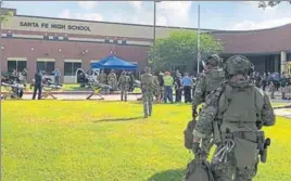  ?? REUTERS ?? Law enforcemen­t officers at Santa Fe High School following the shooting incident on Friday.