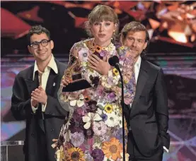  ?? CHRIS PIZZELLO/INVISION/AP ?? Taylor Swift accepts the award for album of the year for “Folklore” at the 63rd annual Grammy Awards.