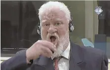  ?? Apphotos ?? DRINK OF DEATH: As he brought a bottle to his lips, former Bosnian Croat military commander Slobodan Praljak shouted, ‘I am not a war criminal!’ and drank liquid that he said was poison.