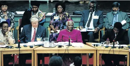  ?? /JON HRUSA ?? Archbishop Emeritus Desmond Tutu and other commission­ers during the Truth and Reconcilia­tion Commission hearings in the mid- and late-1990s.
