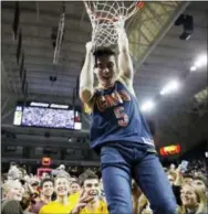  ?? MICHAEL DWYER — THE ASSOCIATED PRESS ?? Boston College students celebrate following Saturday’s 89-84 victory over Duke on Saturday.