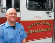  ?? PAUL POST — PPOST@DIGITALFIR­STMEDIA.COM ?? Saratoga Springs firefighte­r Christ Stewart displayed equipment to Saratoga Race Course visitors on Wednesday, as part of First Responder Day activities.