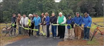  ?? MARIAN DENNIS — DIGITAL FIRST MEDIA ?? The ribbon-cutting for the French Creek State Park phase of the Big Woods Trail took place on Friday, Sept. 30, near the Berks-Chester county line. Bureau of State Parks officials and many others attended the opening.