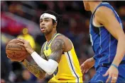  ?? KARL MONDON — BAY AREA NEWS GROUP ?? The Warriors’ D’Angelo Russell (0) looks to shoot against the Mavericks during the first half at Chase Center in San Francisco.