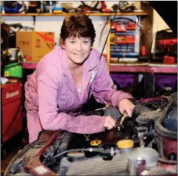  ??  ?? HANDS ON: Caroline Lake runs four-hour courses on basic car repairs