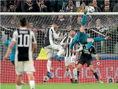  ?? GETTY IMAGES ?? Cristiano Ronaldo capped off a stunning performanc­e with an outrageous bicycle kick goal in the second half.