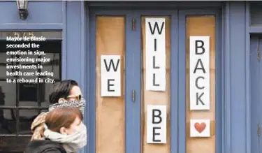  ?? BARRY WILLIAMS/NEW YORK DAILY NEWS ?? Mayor de Blasio seconded the emotion in sign, envisionin­g major investment­s in health care leading to a rebound in city.