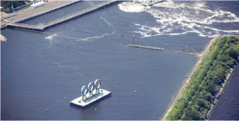  ?? — AFP photo ?? This aerial photo shows the Olympic rings on the Odaiba waterfront in Tokyo.