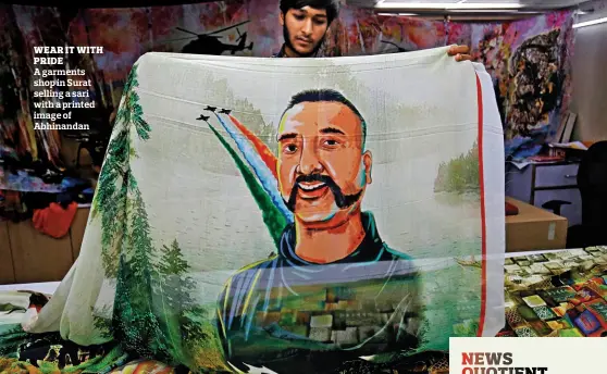  ?? AMIT DAVE / REUTERS ?? WEAR IT WITH PRIDE A garments shop in Surat selling a sari with a printed image of Abhinandan