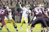  ?? MATT GENTRY/AP ?? Notre Dame quarterbac­k Jack Coan throws a pass during the second half against Virginia Tech on Saturday.