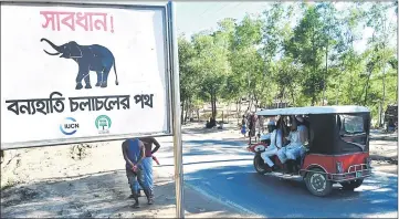  ??  ?? A sign that reads ‘Warning - Route for Wild Elephants’ is pictured near Bangladesh’s Balukhali camp for Rohingya refugees. — AFP photo