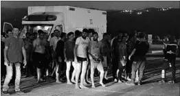  ?? GETTY-AFP ?? Survivors thought to be migrants line up near an ambulance Wednesday in Turkey.