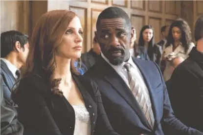  ?? MICHAEL GIBSON/STXFILMS ?? Jessica Chastain and Idris Elba in “Molly’s Game.”