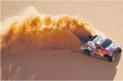  ?? AFP ?? Toyota’s Nasser al-Attiyah and Mathieu Baumel compete in the third stage.