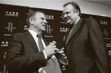  ?? Mark Mulligan / Staff photograph­er ?? Tilman Fertitta, left, talks with Rockets general manager Daryl Morey at a news conference on Oct. 10, 2017, four days after buying the team from Leslie Alexander.